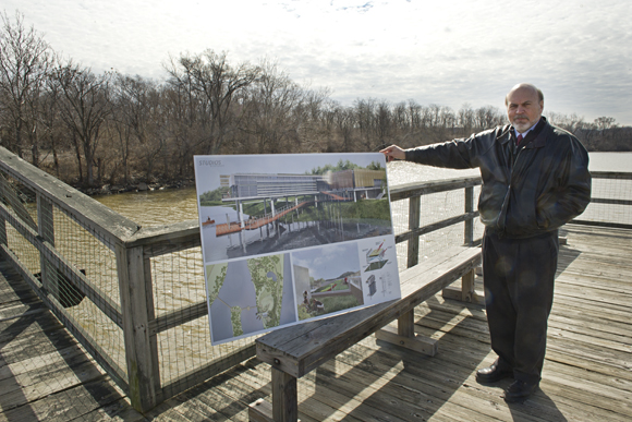 Steven Mutschler, managing director for Living Classrooms of the National Capital Region, with renderings for a proposed nature center on Kingman Island on the Anacostia River